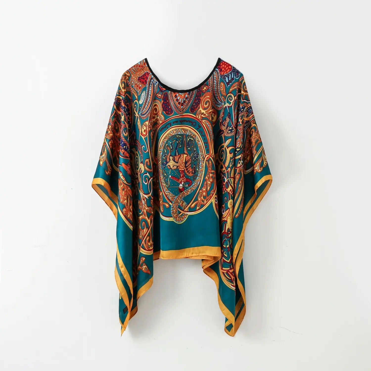 Printed silk patterned pullover shawl cape outerwear in teal and gold with intricate ornate designs.