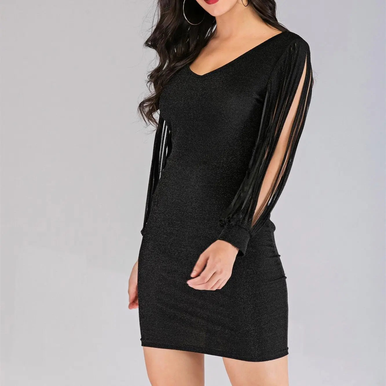 Black sequin tassel sleeve mini dress featuring a shimmering long-sleeved design with sheer fringe detailing on the arms.