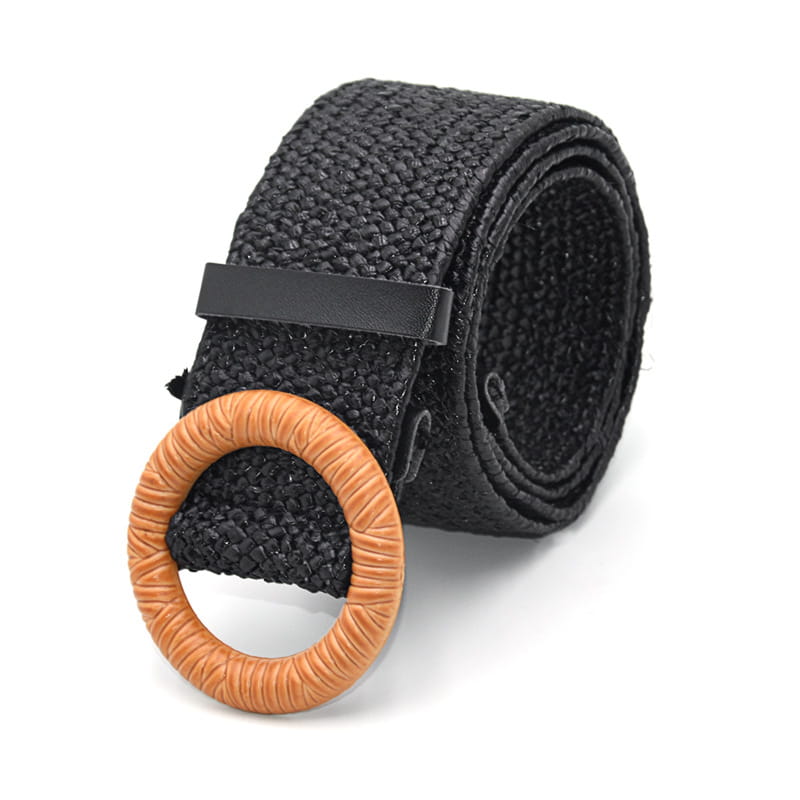 Black woven elastic belt featuring a tan textured round buckle and black leather tab.