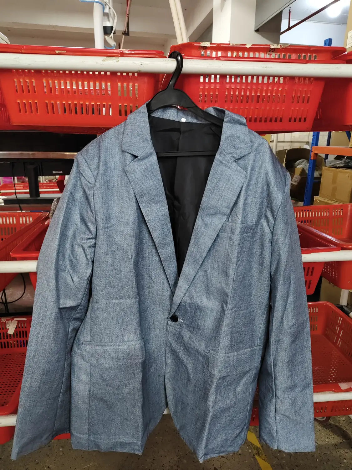Mens slim fit casual blazer british style suit in light blue textured fabric featuring a single black button and black inner lining.