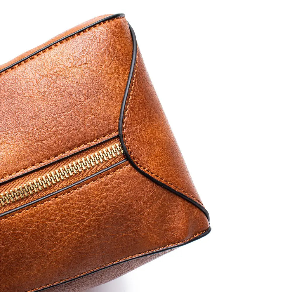 Premium brown leather hobo crossbody bag in tan leather with black stitching and a gold-toned zipper.