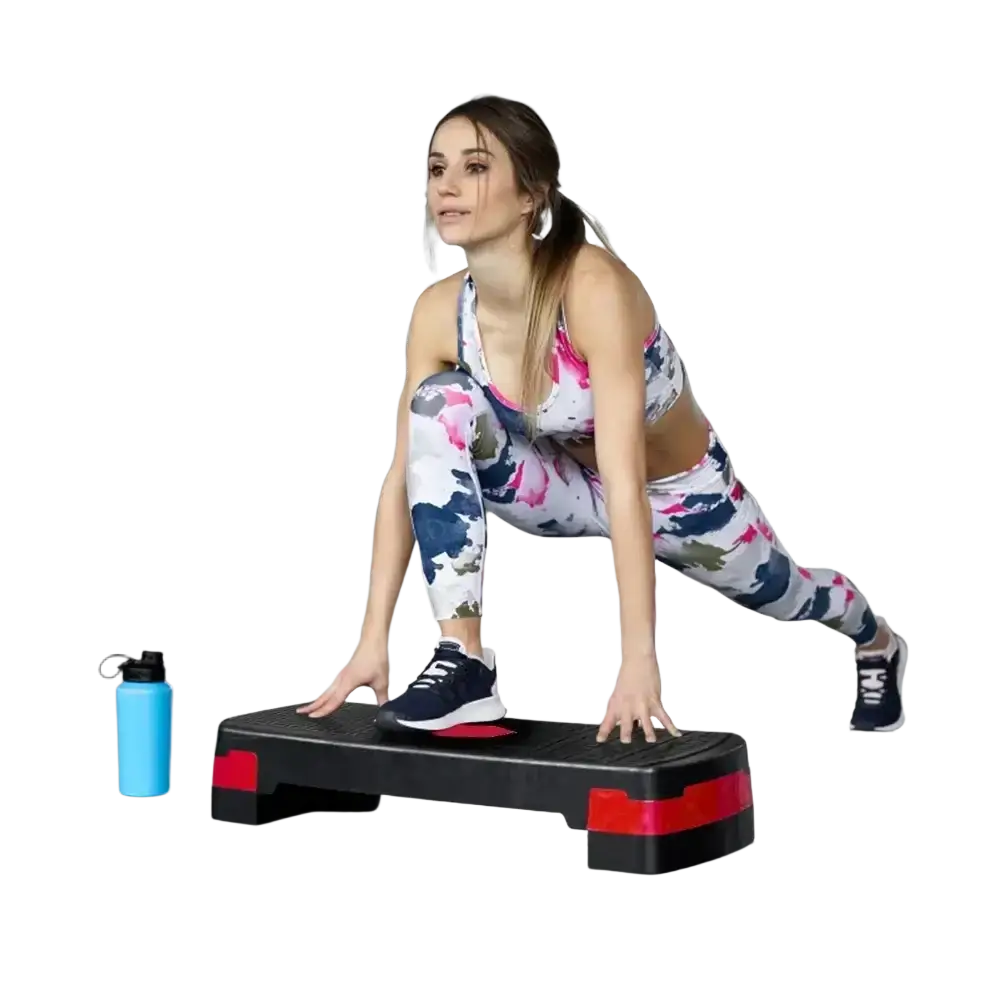 Black and red aerobic stepper platform with textured surface designed for home workout fitness use