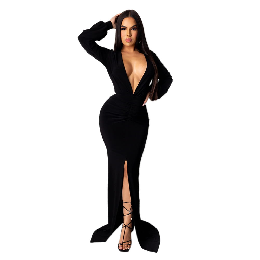 Black velvet bodycon evening dress with a deep v-neckline and high slit.