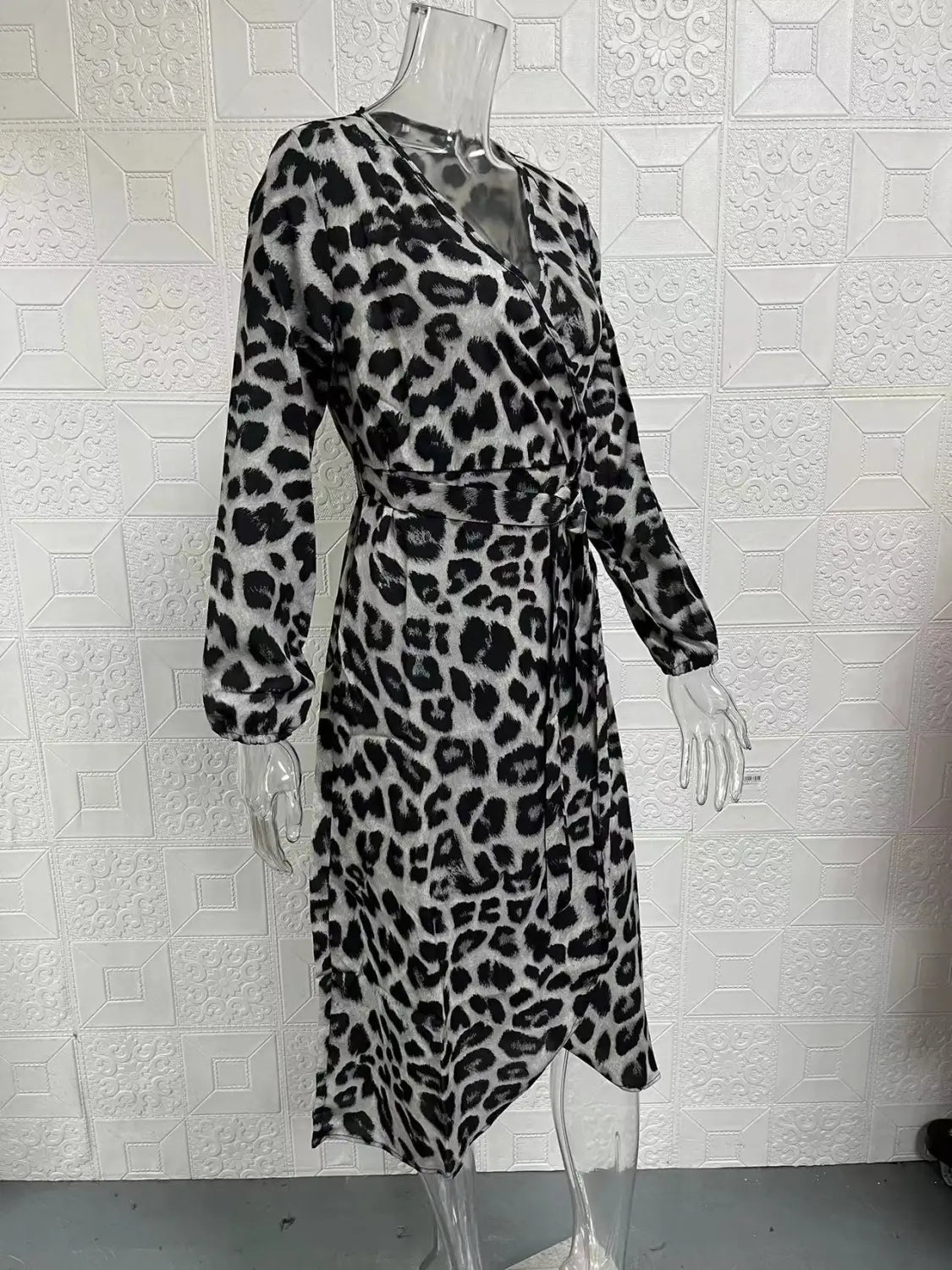 Black and white leopard print chiffon wrap dress with long sleeves and a v neck.