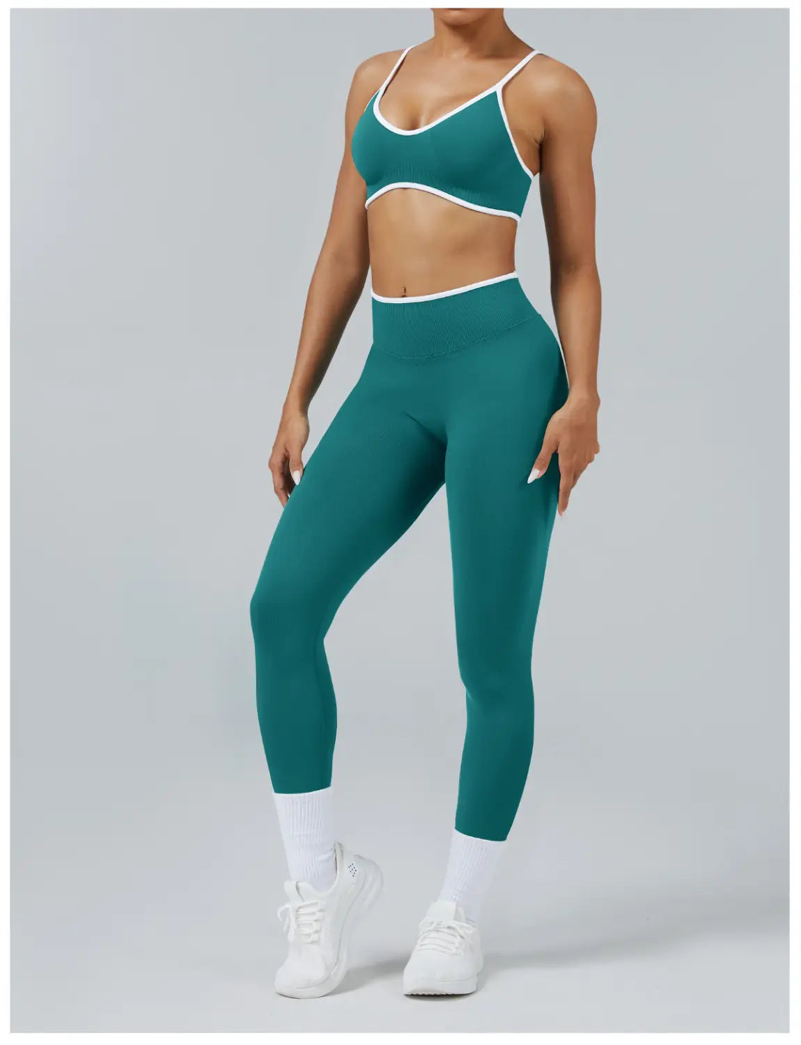 Teal and white seamless two-piece athletic set with form-fitting design featuring high waist sports yoga leggings.