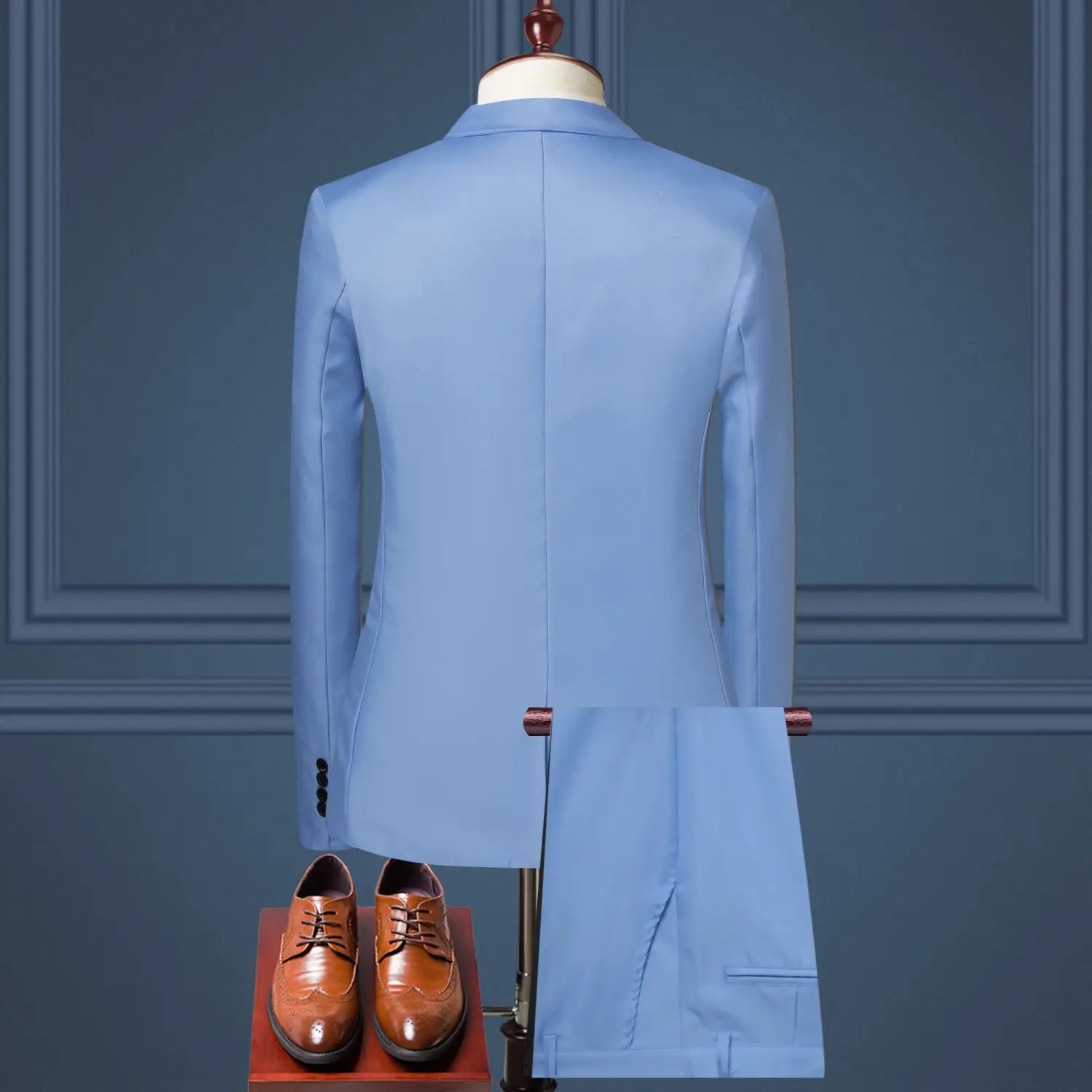 Light blue tailored suit jacket made of solid color fabric displayed on a mannequin for men solid color two piece leisure suit.