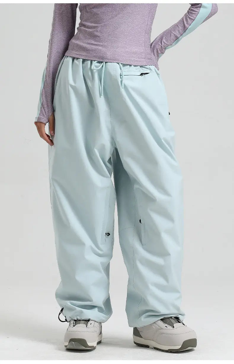 Light blue waterproof windproof snow pants with a drawstring waist and elastic cuffs designed as loose work trousers.