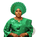 African turban auto gele headwrap in emerald green braided fabric with silver beaded floral embellishments