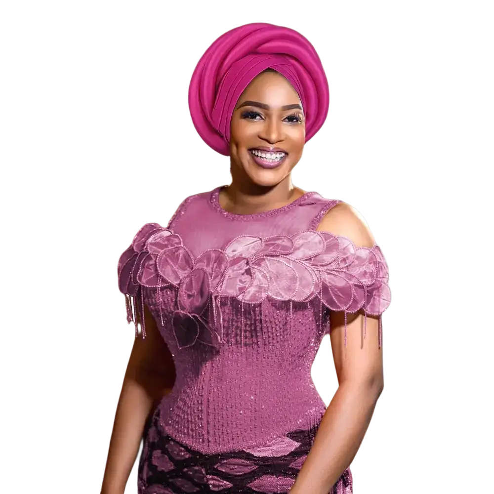 A woman wears a vibrant pink african women twisted turban head wrap with intricate folds and a matching sequined top