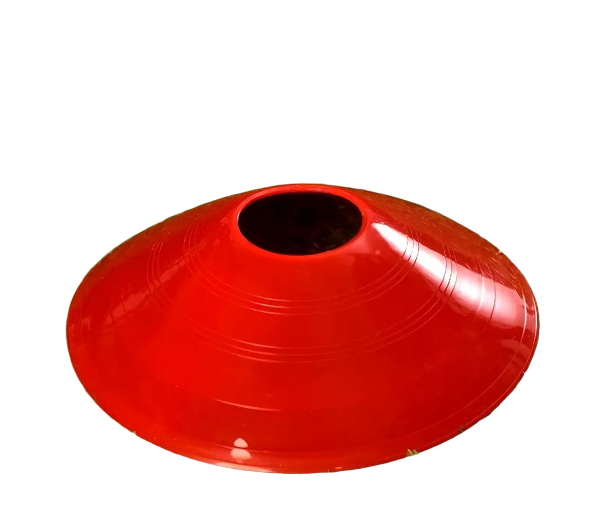 Bright red plastic agility soccer training cone with central hole and concentric ridges for improved stability