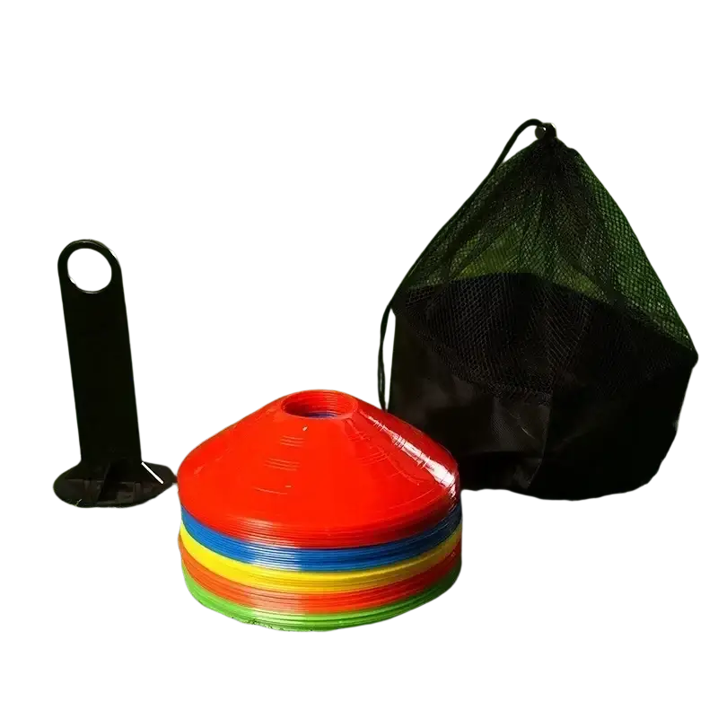 Stack of colorful red blue yellow and green plastic agility soccer training cones for sports drills and practice