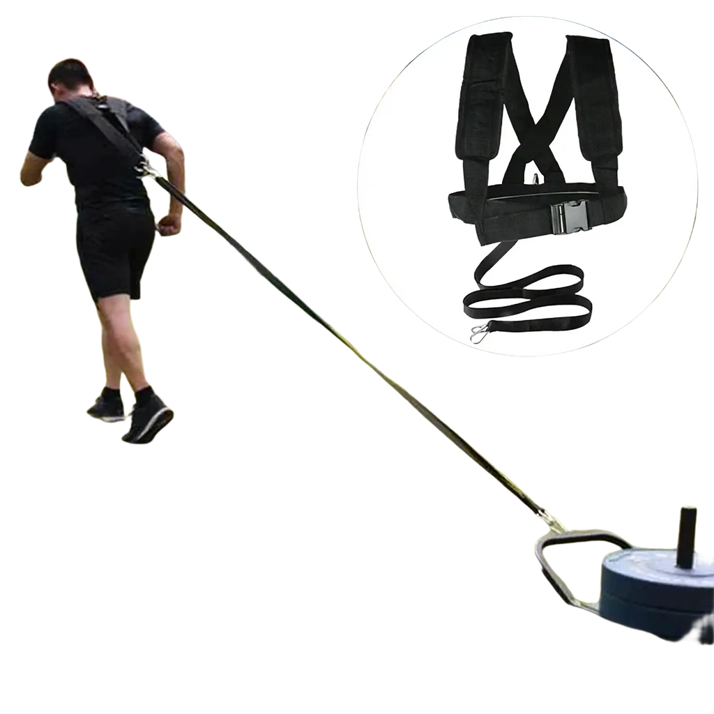 Black resistance training harness with adjustable straps and metal buckle connected to weighted sled for agility training