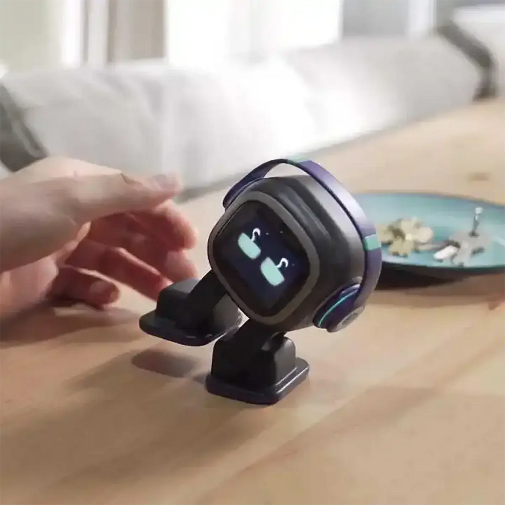 A compact black and purple ai smart companion robot toy with a glowing screen displaying cartoon eyes