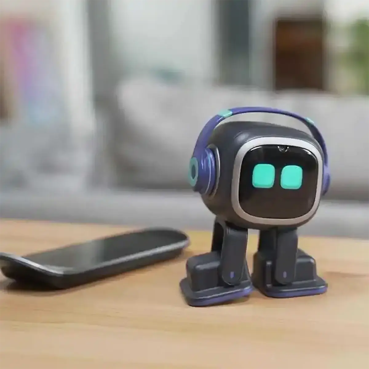 Ai smart companion robot toy in black and purple with glowing teal eyes and built-in headphones on rounded head