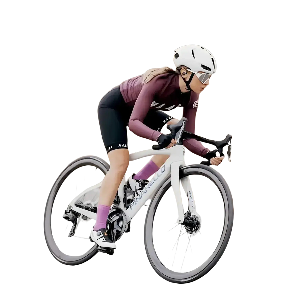 White pinarello road bicycle with black handlebars and purple accents displayed alongside air conduction ear hook headphones with charging case
