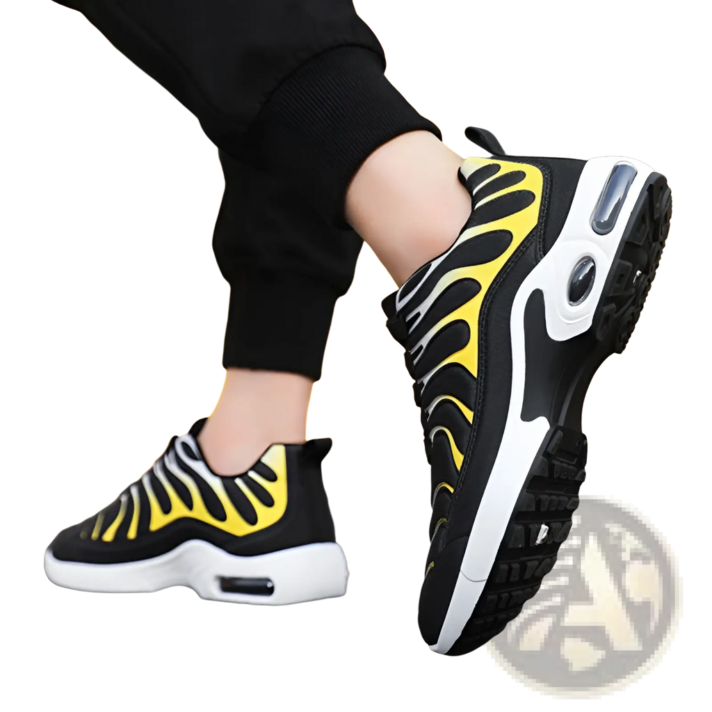 Black and yellow Nike Air Max Plus running shoes with flame pattern side design white midsole and visible air cushioning units