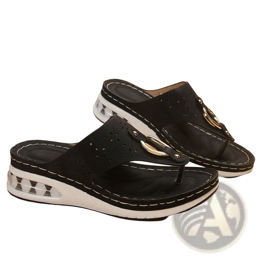 Black perforated leather air cushion thong sandals with white wedge sole and gold-tone metal buckle