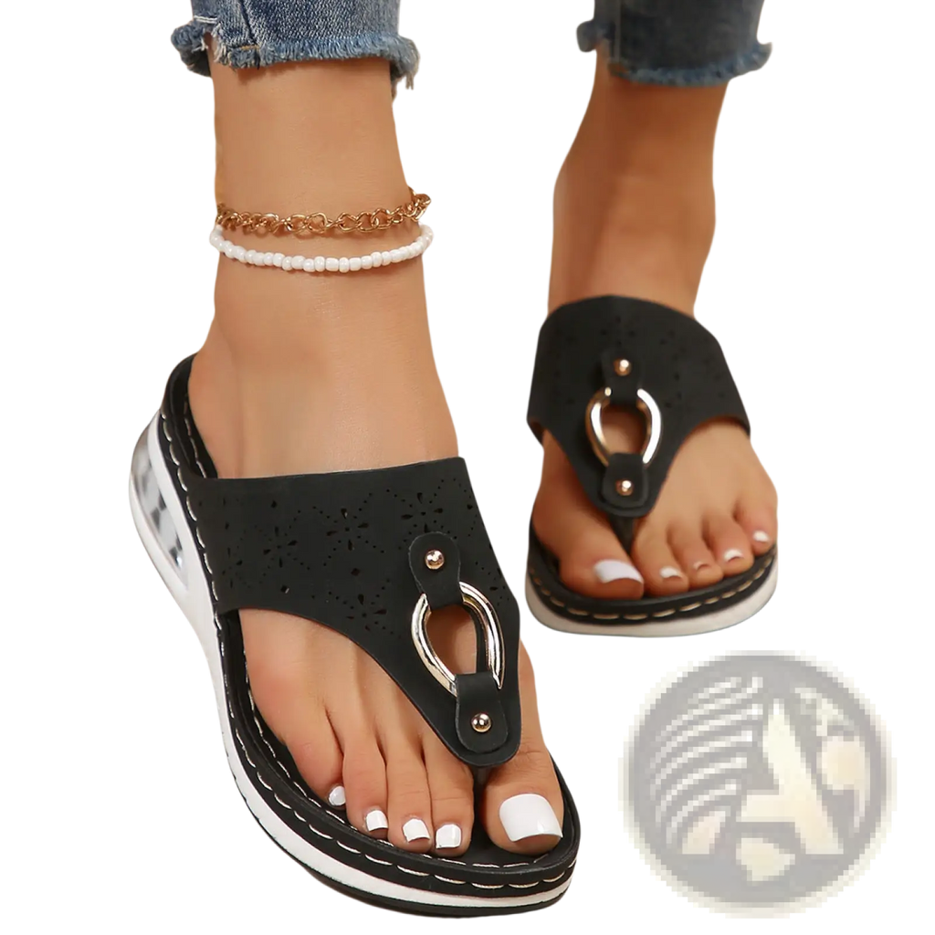 Black perforated leather air cushion thong sandals with silver metal ring detail and white wedge soles
