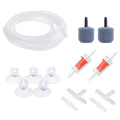 Clear plastic air tube with transparent cylindrical air stones and orange check valves for fish tank aeration kit
