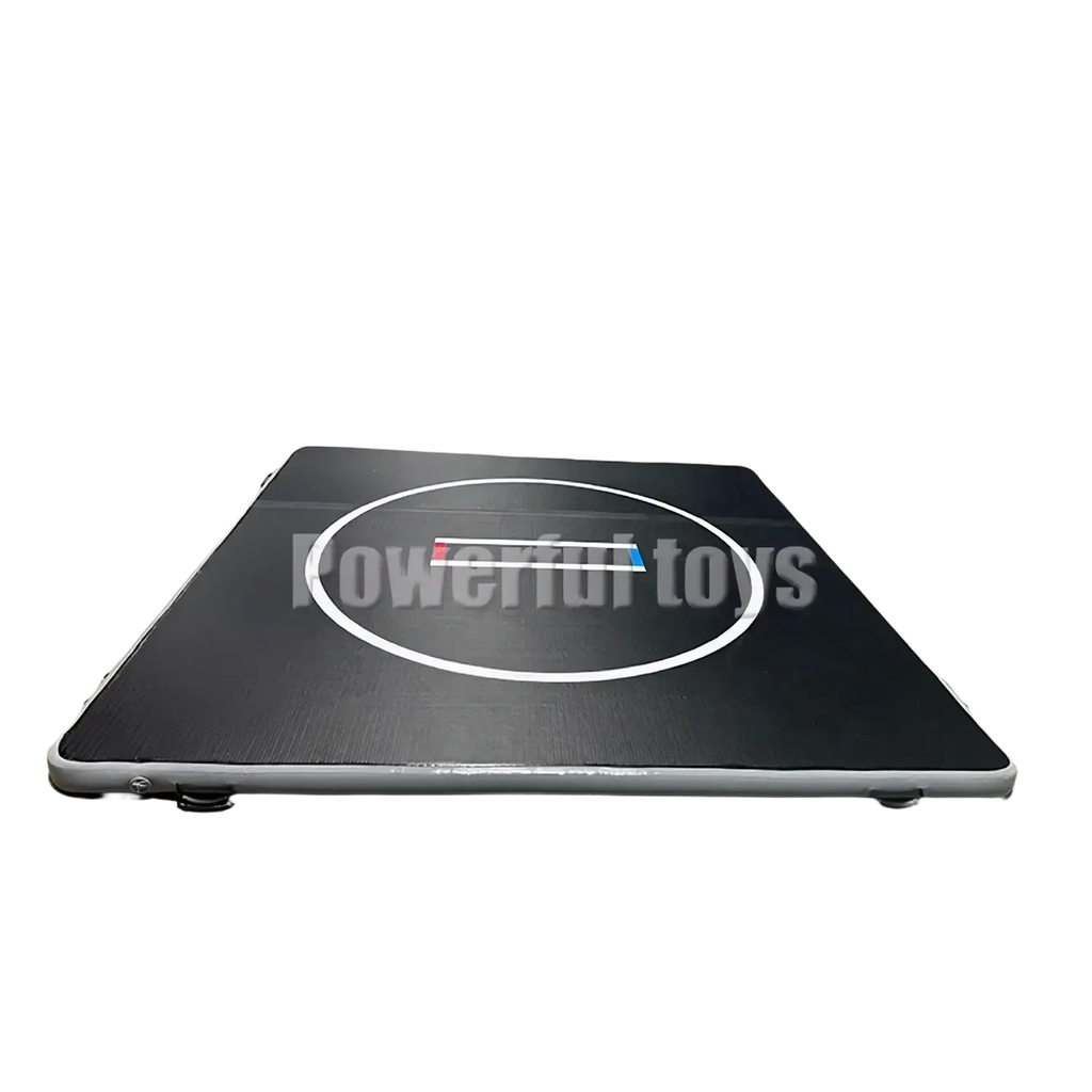 Black inflatable air track gym mat with white circular center and red blue logo for training floor use