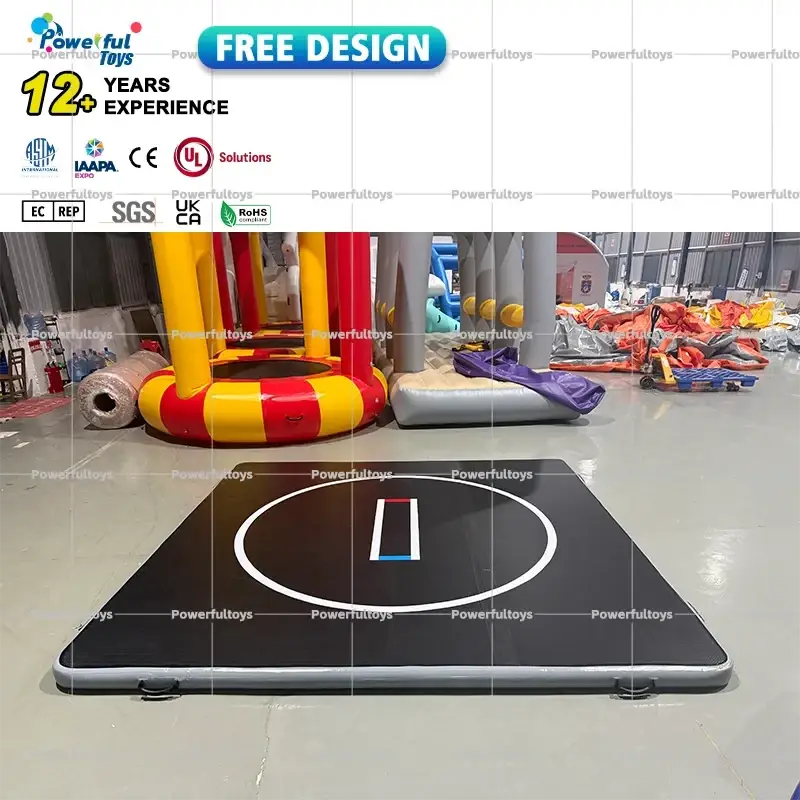 Black inflatable air track gym mat with white circular marking and blue stripe for training and inflatable water use