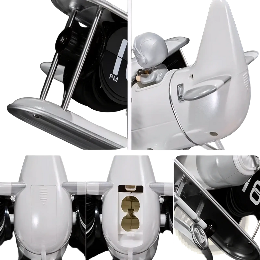 White plastic airplane model with silver metallic accents and pilot figure inside used as a vintage flip desk clock decor