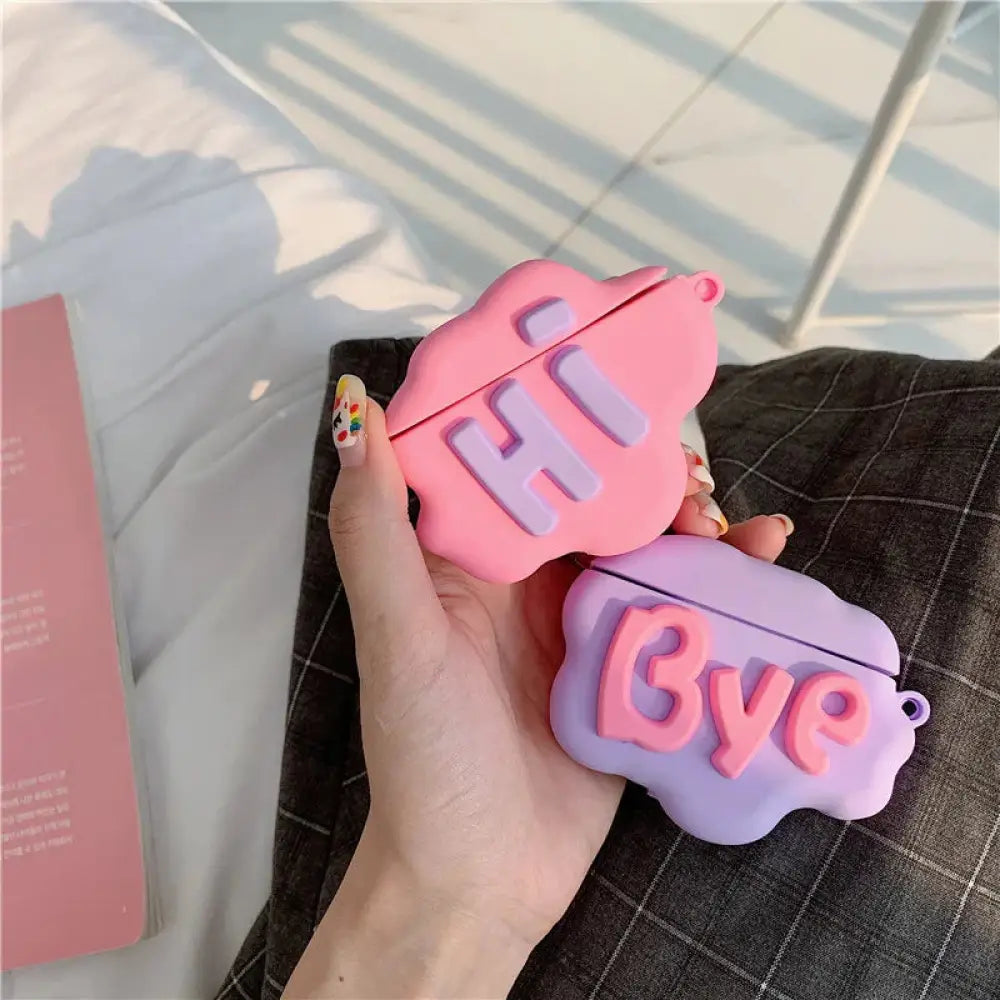 Pink and lavender 3d hi bye speech bubble silicone airpods 2 case covers with raised lettering in front view