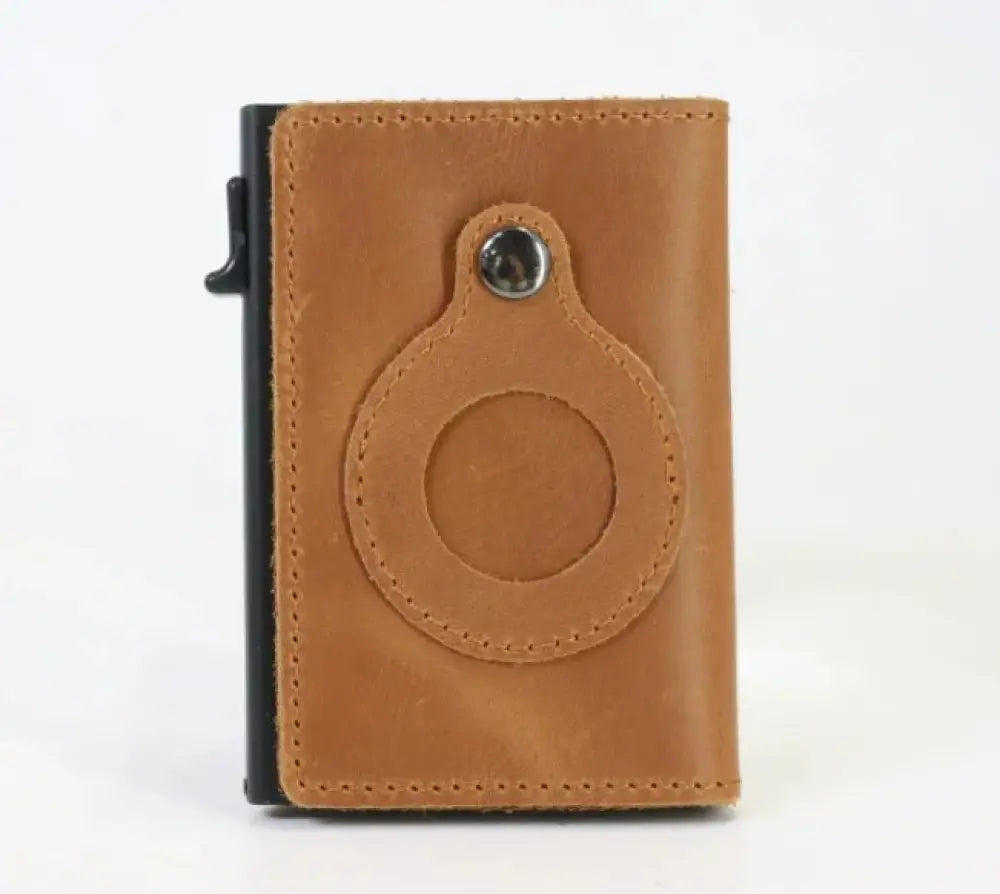 Tan leather RFID slim airtag wallet with circular cutout and silver metal ring for anti theft card protection