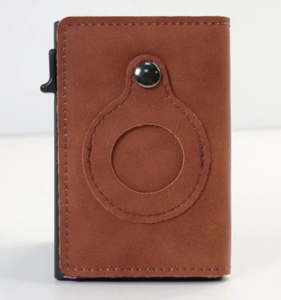 Brown leather rfid slim airtag wallet with circular cutout and black snap button for anti theft card holding