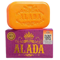 Vibrant orange alada brightening cleansing soap bar with embossed crown on purple packaging for glowing skin feeling