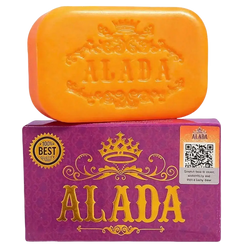 Vibrant orange alada brightening cleansing soap bar with embossed crown on purple packaging for glowing skin feeling