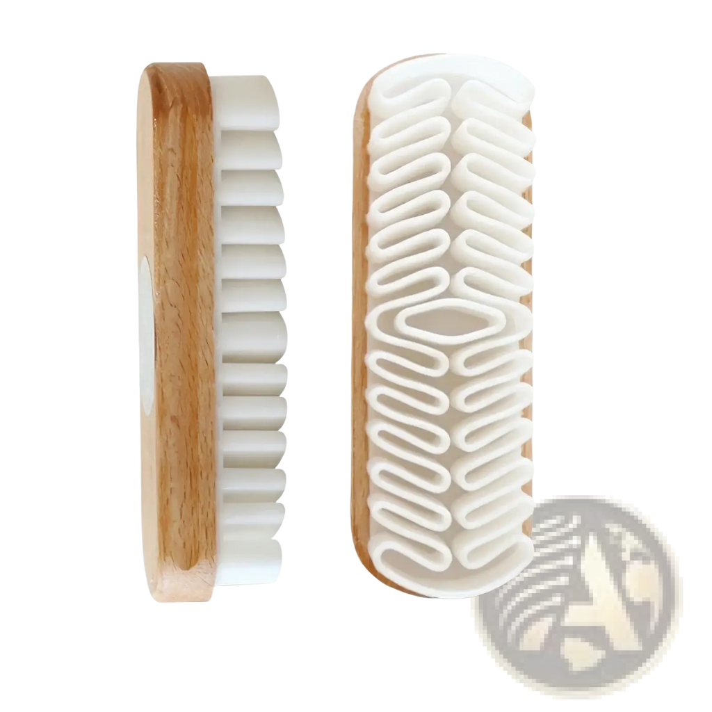 Alcantara suede car interior cleaning brush with a natural wood handle and white plastic bristles arranged wavy