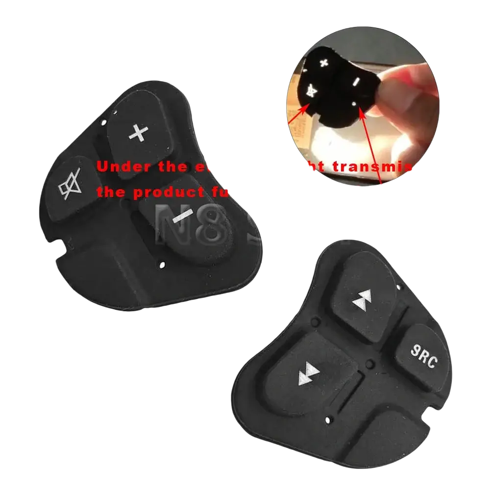 Black plastic Alfa 147 steering wheel audio control buttons with white directional and function symbols