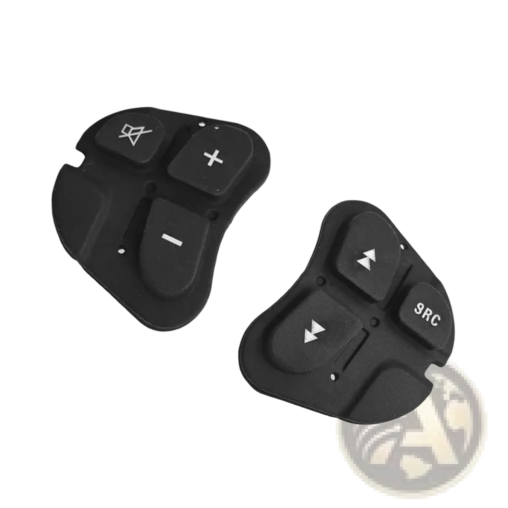 Black plastic Alfa 147 steering wheel audio control button panels with white symbols and markings on the front side