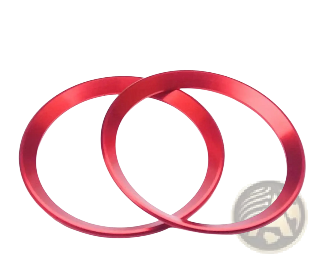 Two vibrant red metallic Alfa Romeo Giulia Stelvio air vent trim rings with a sleek brushed finish