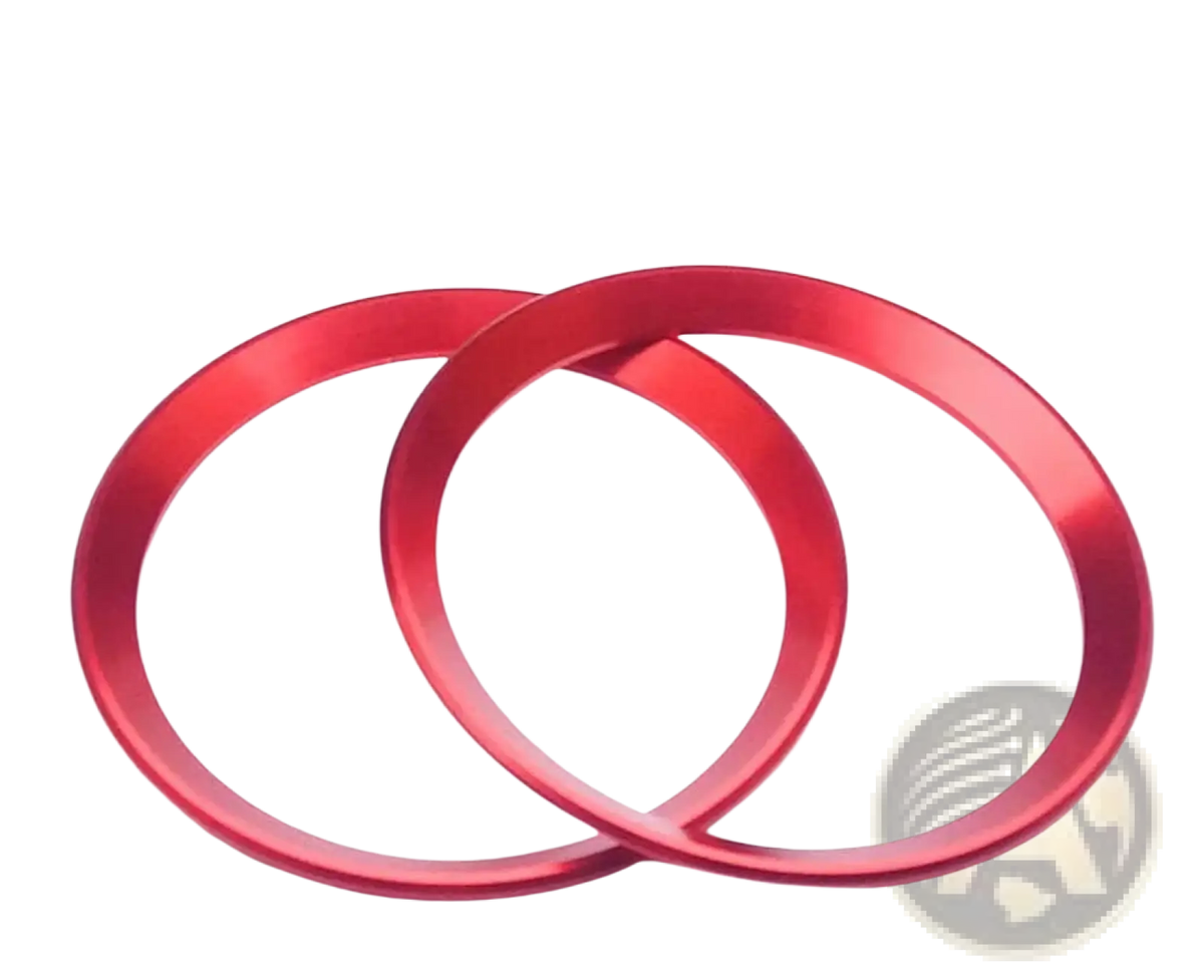 Two vibrant red metallic Alfa Romeo Giulia Stelvio air vent trim rings with a sleek brushed finish