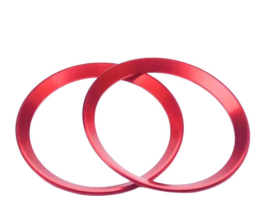 Two vibrant red metallic Alfa Romeo Giulia Stelvio air vent trim rings with a sleek brushed finish