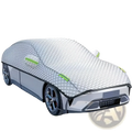 Silver quilted all-season waterproof car windshield sunshade cover with green trim and black edge detailing