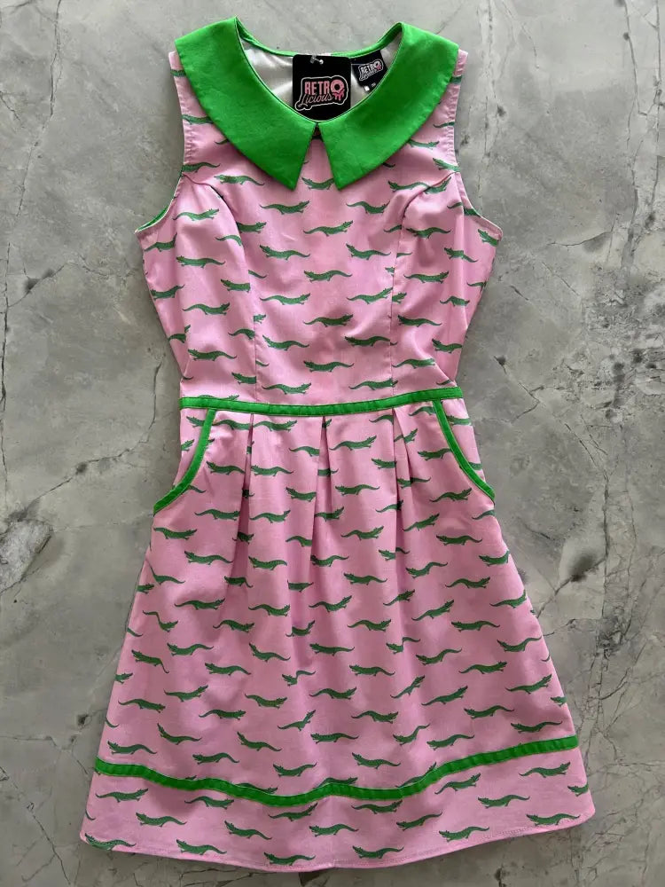 Pink retro alligator print cotton sleeveless dress with green collar waistband hemline and pockets