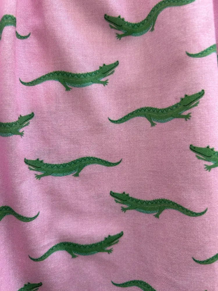 Pink retro alligator print cotton dress with pockets featuring pink fabric and green crocodile pattern
