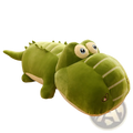 A plush green alligator soft crocodile sleep pillow with velour texture large yellow eyes and stitched smile