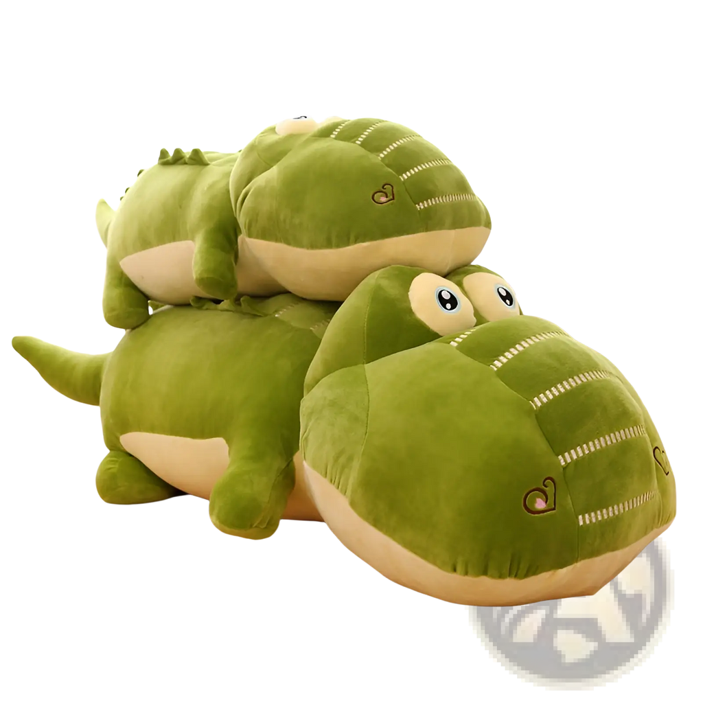 Soft green and cream plush alligator toy with embroidered eyes and heart details for use as a sleep pillow