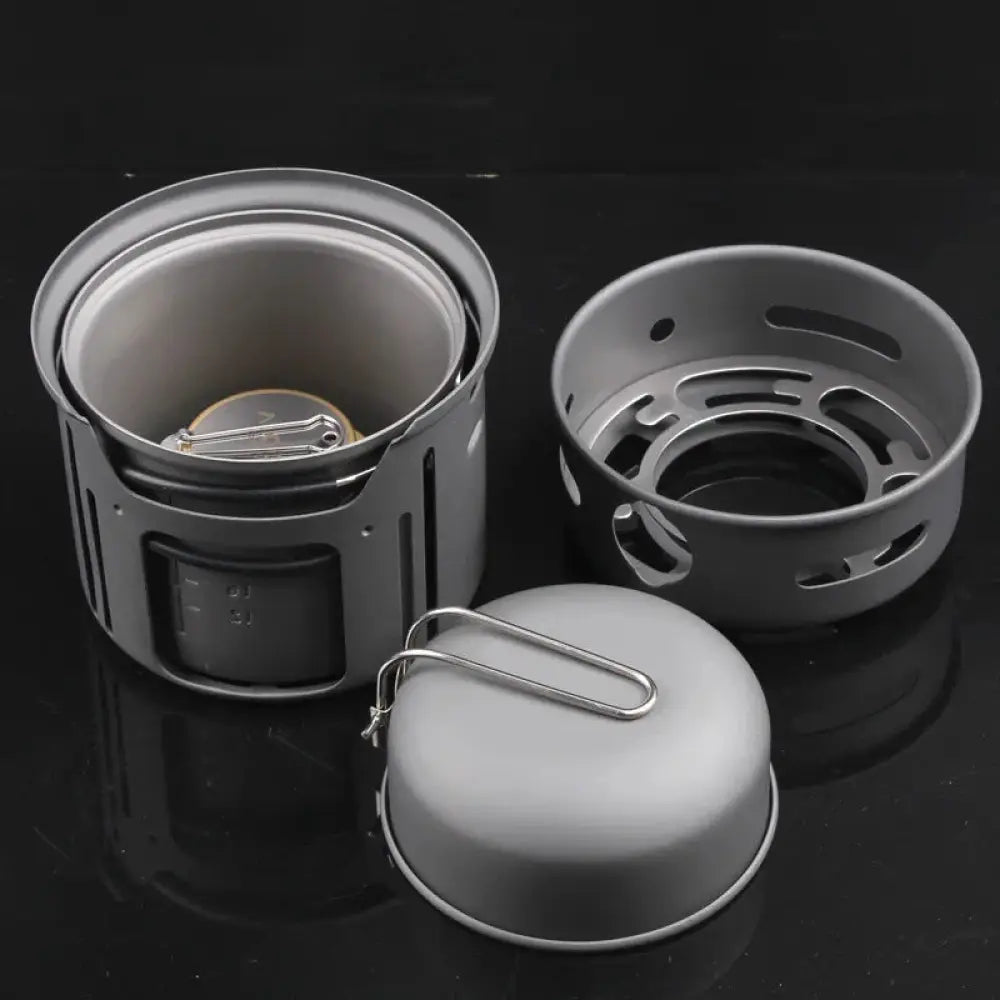 Gray aluminum 7-piece portable camping stove and cookware set with detachable burner and lid for outdoor cooking