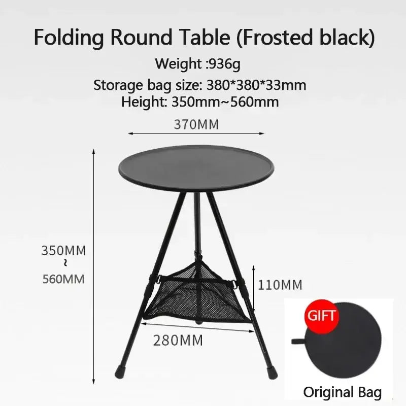 Frosted black aluminum alloy folding camping table with round top tripod legs and mesh storage basket underneath