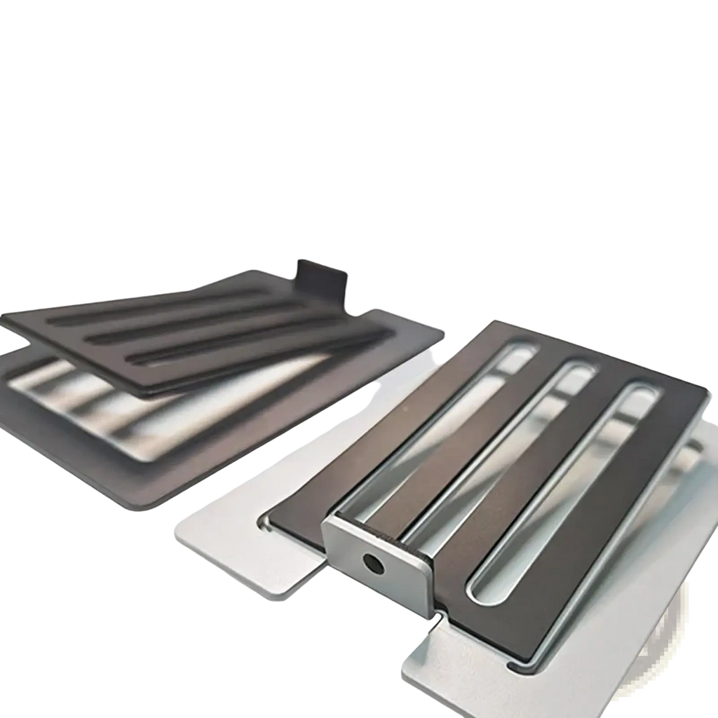 Modern black and silver metal toaster crumb trays with sleek minimalist design shown alongside aluminum desktop speaker stands with 16 degree tilt