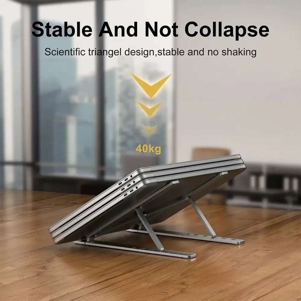 Silver metallic aluminum foldable portable laptop stand with triangular foldable design for ergonomic use