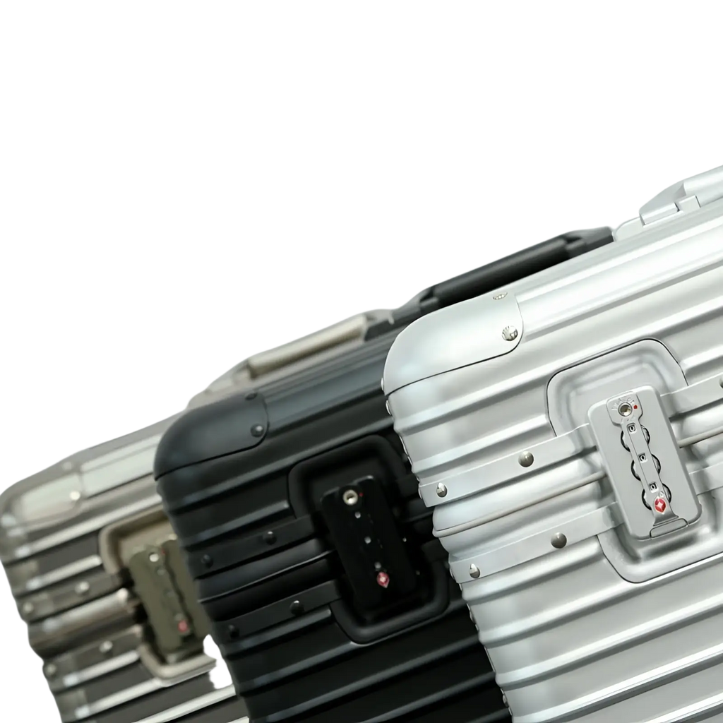 Silver aluminum ribbed rolling travel suitcase 20-24 with combination lock for secure packing and easy transport
