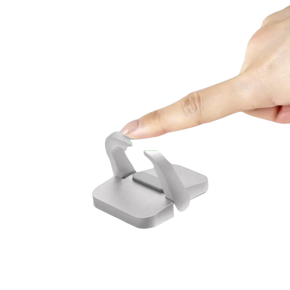 Silver aluminum mini portable laptop stand with a sleek magnetic phone holder and sturdy base for secure placement