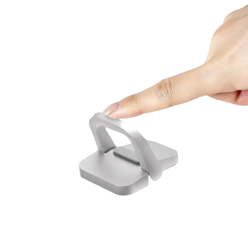 Silver aluminum portable laptop stand with minimalist design and integrated handle featuring portable legs