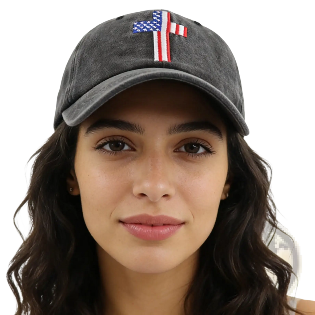 A dark gray distressed baseball cap made of fabric featuring an embroidered American flag cross on the front